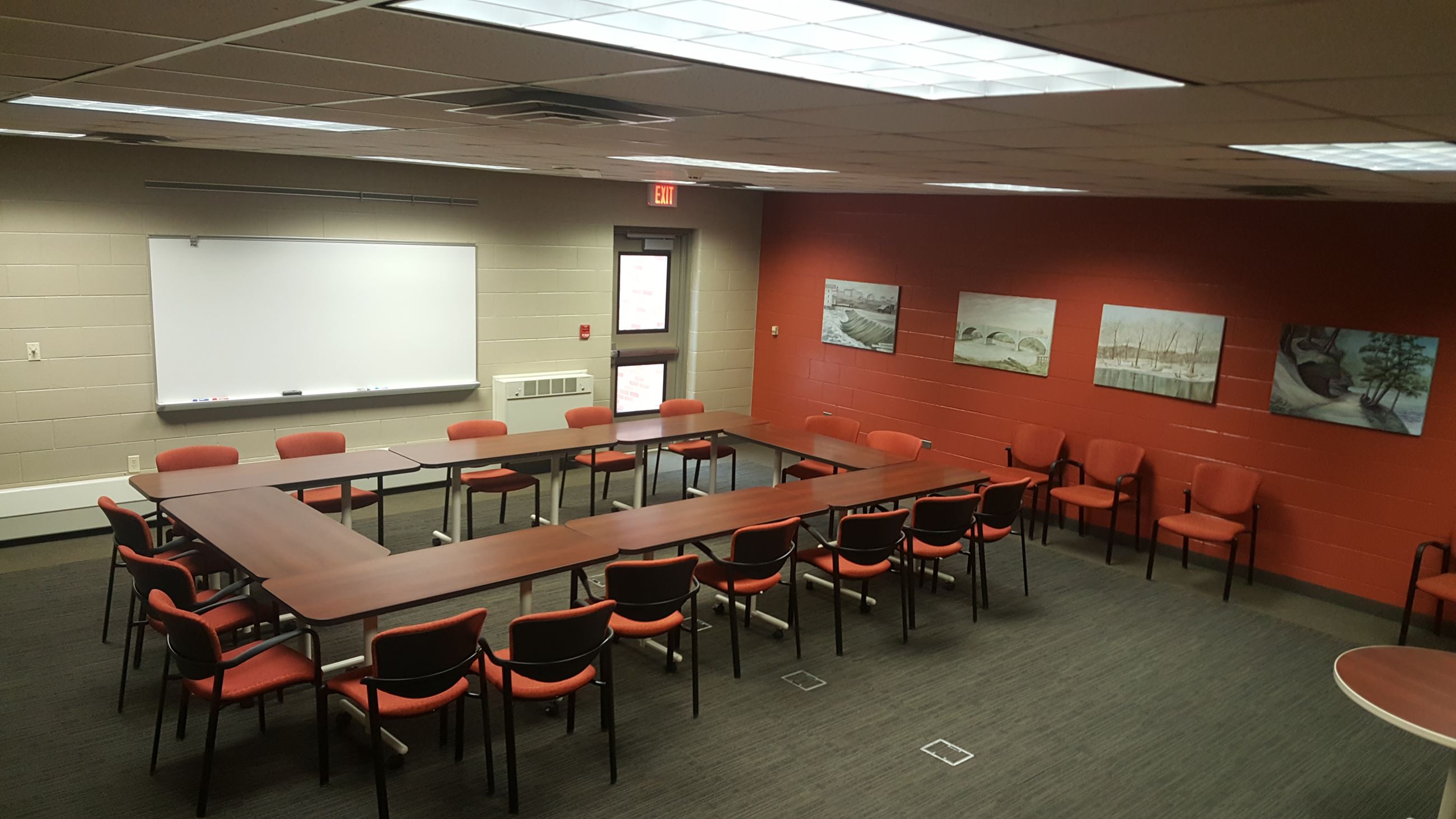 Meeting room with tables and chairs for B106