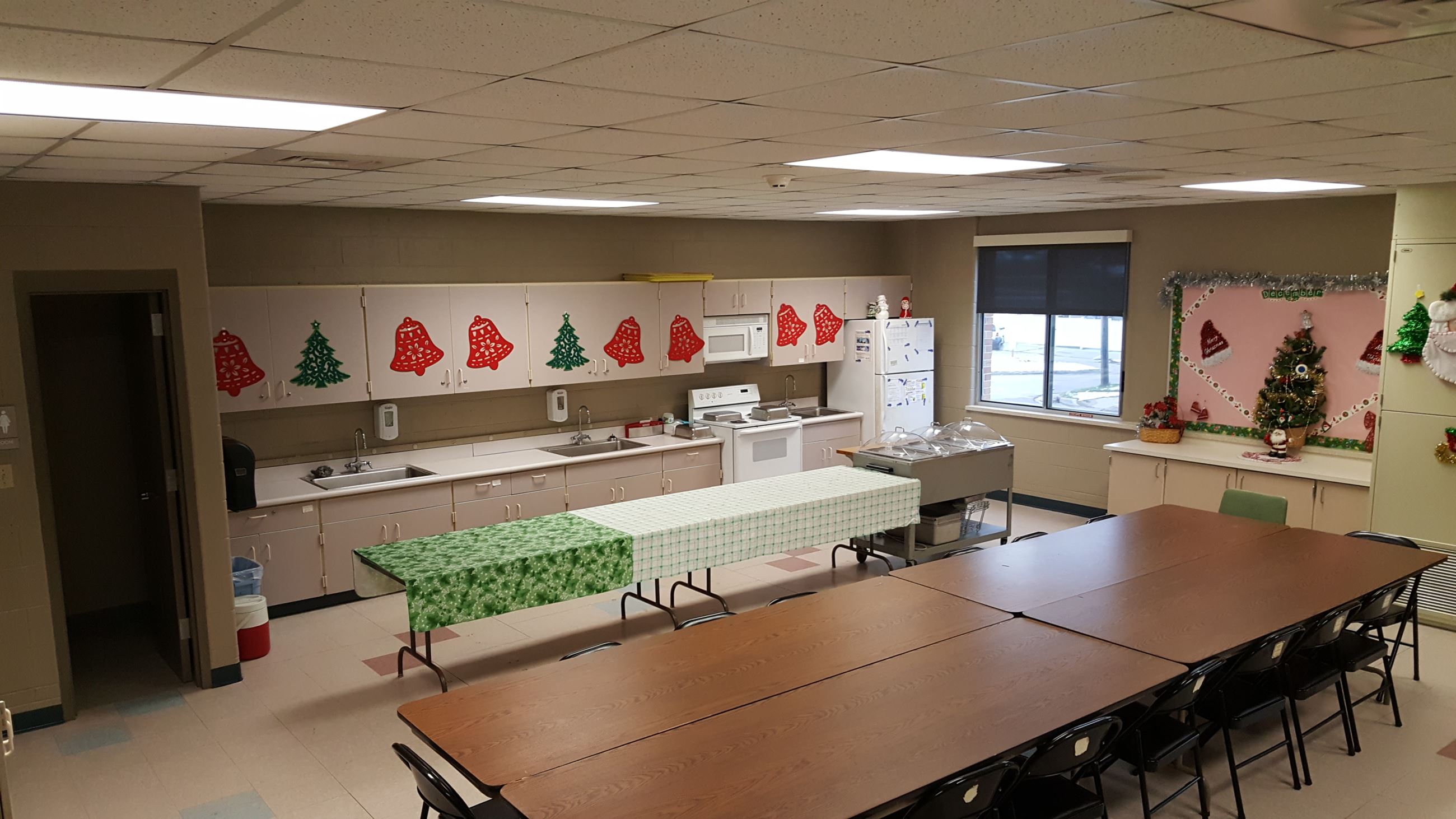 Community Room B100 with tables and sink